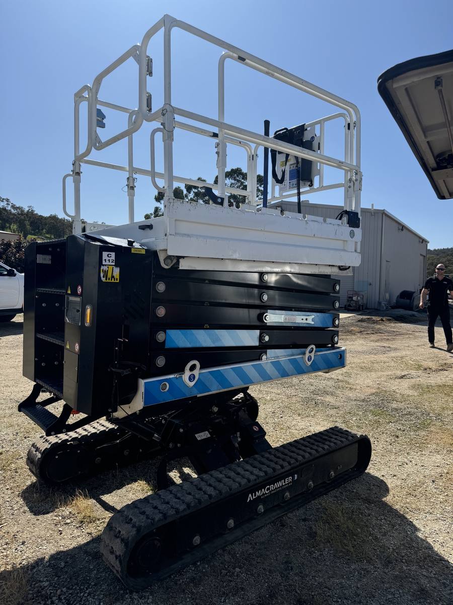Tracked scissor lift on site